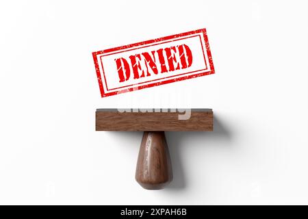 Rubber stamp imprints the word denied on white paper. Rejection in business like loan applications or document approvals. Refusal or denial of access, Stock Photo