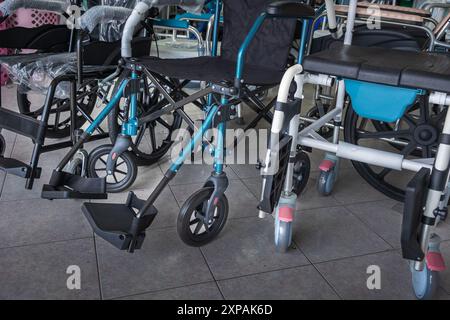 wheelchairs on display in the store. Brand new modern design wheel chairs for disabled people. Metal heavy duty wheel chairs for Senior citizen, elder Stock Photo