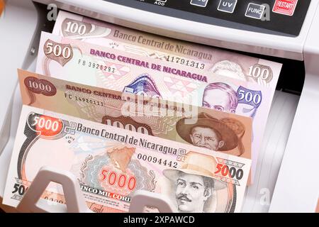 Old Nicaraguan money - cordoba in the counting machine Stock Photo