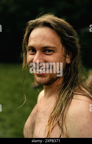 Long-haired Slavic man with pagan tattoos on his face, Ivan Kupala. Stock Photo