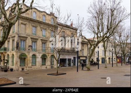 Arles, France - March 7, 2023: Empty street in the center of Arles on a cloudy day in winter Stock Photo