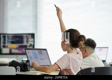 Engaging Students Answering Question in Computer Class Stock Photo