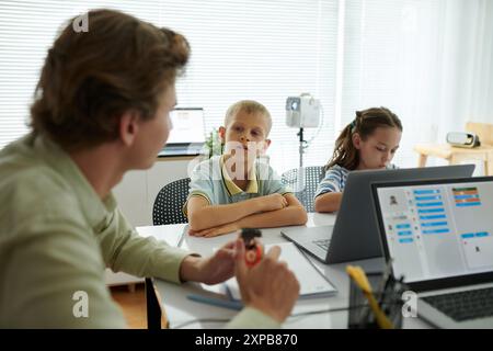 Teaching Children in Modern Classroom Setting Stock Photo