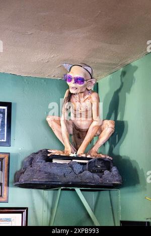 Statue of Gollum in sunglasses at the Hobbit Cafe - Tolkien and Lord of the Rings themed restaurant, Houston, Texas Stock Photo