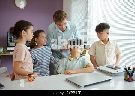 Teaching Children Using Virtual Reality in Classroom Setting Stock Photo