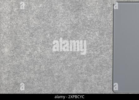 Close up Grey synthetic textile, Alcantara texture use on premium computer notebook. Surface of leatherette for textured background. Stock Photo