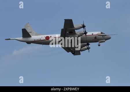 A Japanese Maritime Self Defence Force (JMSDF) Air Development Squadron Lockheed UP-3C Orion Maritime reconnaissance aircraft flying near NAF Atsugi airbase. Stock Photo