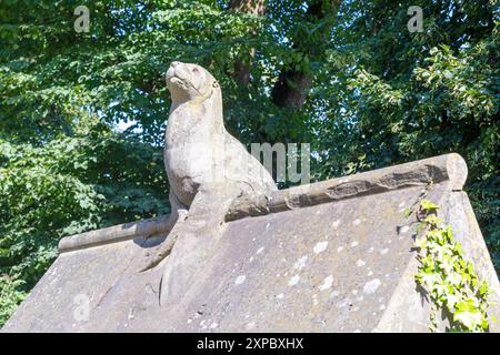 A stone seal on Animal Walk, Bute Park, Cardiff UK. Sculpture in 1880s by William Frame to the designs drawn by William Burges. Stock Photo