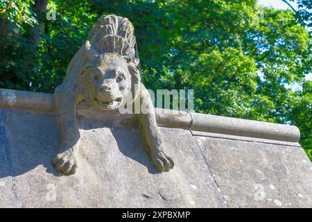 A stone hyena on Animal Walk, Bute Park, Cardiff UK. Sculpture in 1880s by William Frame to the designs drawn by William Burges. Stock Photo