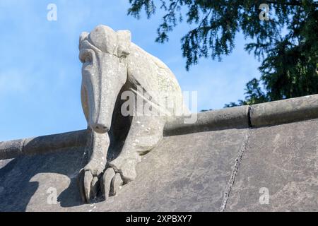 Stone anteater sculpture on Animal Wall, Bute Park, Cardiff, Wales, designed by William Burges and sculpted by William Frame in the 1880s. Stock Photo