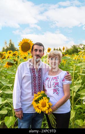 mother and son in the sunflower field Stock Photo - Alamy