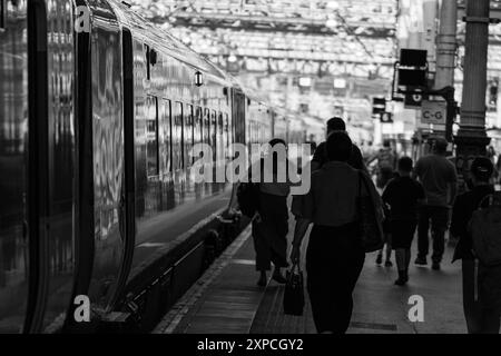 Platform and train at Edinburgh Waverly train station in Scotland Stock Photo