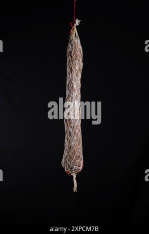 Close-up of Rosette de Lyon sausage, a famous Lyonnais culinary specialty against a black background. Stock Photo