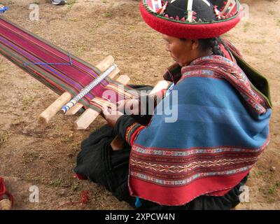 Woman working on traditional textiles in the Andes, Peru Stock Photo