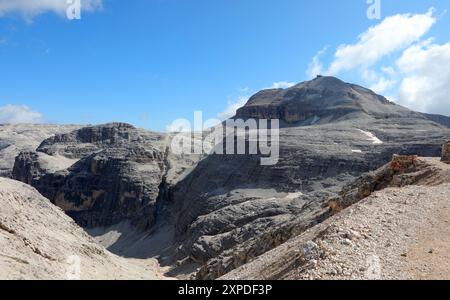 wide view of mountains of the Dolomites Alps with the peak of the mountain called Piz Boè where there is the Capanna Fassa alpine hut Stock Photo