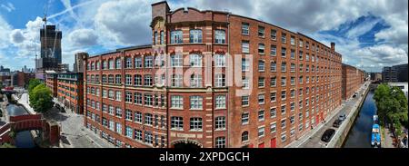 Red brick, old cotton mills buildings next to Rochdale canal in Ancoats, Manchester Stock Photo