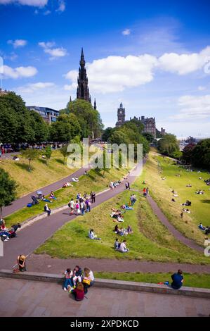 Tourists relaxing in the Princess Street gardens in Edinburgh on a summer day Stock Photo