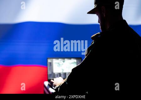 Federal Security Service unit responsible for Russia air defense, relaying instructions to squadrons patrolling over borders. Soviet ex KGB FSB military specialist uses laptop to do monitoring Stock Photo