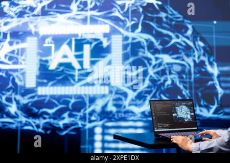 AI specialist working in modern lab, emphasizing importance of data driven decision making in tech industry. Engineer developing innovative artificial intelligence solutions for startup Stock Photo