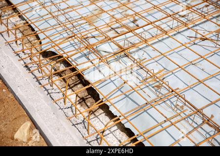 Reinforcing steel wire mesh on the ground of a construction site  Stock Photo