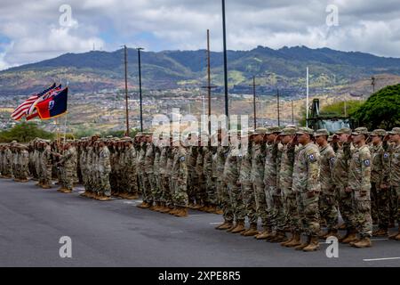 U.S. Soldiers assigned to the 29th Infantry Brigade Combat Team, Hawaii Army National Guard (HIARNG), stand in formation during a change of command ceremony in Kalaeloa, Hawaii, Aug. 3, 2024. The 29th Infantry Brigade was organized in the HIARNG in 1959, and has served in many campaigns around the world, including the Vietnam War, Global War on Terror, Operation Iraqi Freedom, and Operation Enduring Freedom. (U.S. Army National Guard photo by Sgt. Justin Nye) Stock Photo