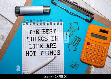 The best things in life are not things - handwriting on a napkin with a cup of espresso coffee Stock Photo