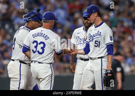 Kansas City, USA. August 5, 2024: Kansas City Royals manager Matt Quatraro (33) takes the ball from Kansas City Royals starting pitcher Brady Singer (51) while Kansas City Royals catcher Salvador Perez (13) and Kansas City Royals third baseman Maikel Garcia (11) look on during the sixth inning against the Boston Red Sox at Kauffman Stadium in Kansas City, MO. David Smith/CSM Credit: Cal Sport Media/Alamy Live News Stock Photo