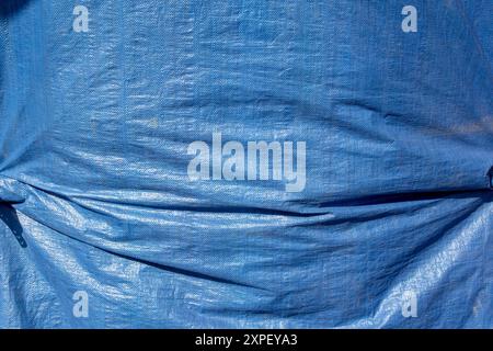 A view of a blue tarp, as a background. Stock Photo