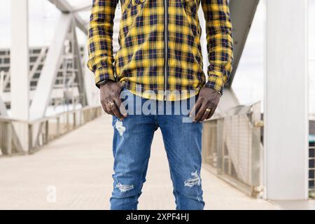 unrecognizable black man with hands in his pockets Stock Photo