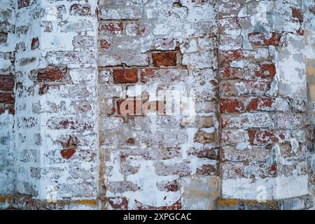 old brick wall texture with destroyed ruined plaster. Urban background. High quality photo Stock Photo