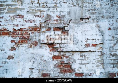 old brick wall texture with destroyed ruined plaster. Urban background. High quality photo Stock Photo