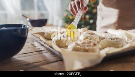Close Up on the Hands of an Anonymous Female Making Pastries to Share with Family and Friends for Christmas. Delicious Buns Being Prepared to be Cooked for Holiday Evening Guests Stock Photo