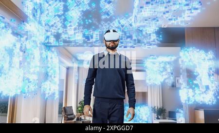 Young Indian Man Wearing a Virtual Reality Headset at Home. He Enters Digital Internet Universe, 3D Particles Transforming The Background. Next Generation Immersive Social Media Online Metaverse. Stock Photo