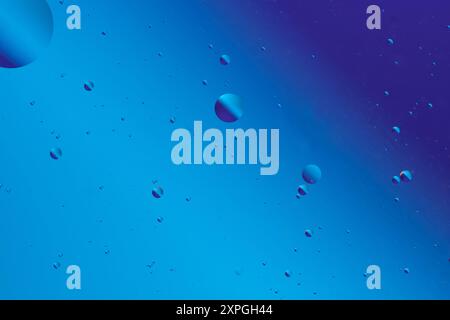 Blue tones and bubbles create an abstract, smooth pattern, reminiscent of calm liquid or underwater visuals Stock Photo