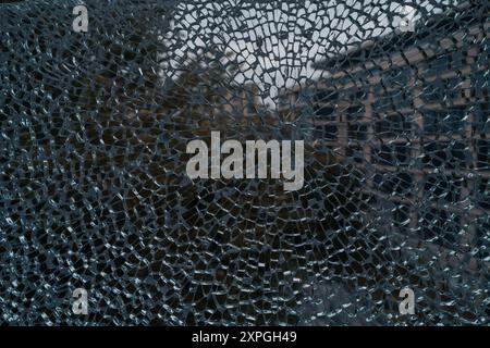 Broken glass on the window of an old building. Abstract background Stock Photo