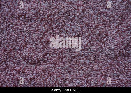 Closeup of red fabric texture. Smooth surface texture. Stock Photo