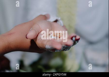 Wedding ring on the bride's palm, taken using a macro or close-up photo technique Stock Photo