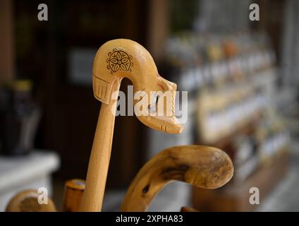 Handcrafted wooden walking sticks on display in Megalo Chorio, Evrytania, Greece. Stock Photo