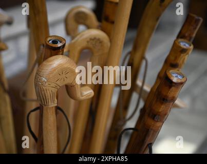 Handcrafted wooden walking sticks on display in Megalo Chorio, Evrytania, Greece. Stock Photo