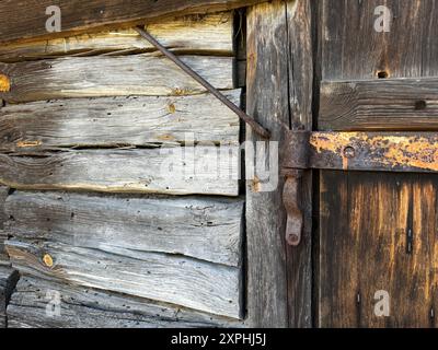 Wall of an old wooden shed with a doorway. Stock Photo