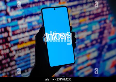 In this photo illustration, the Infosys Limited logo is displayed on a smartphone screen. Stock Photo