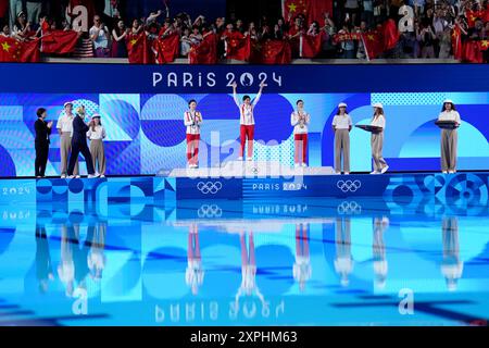 China's Quan Hongchan (centre) on the podium with the gold medal, alongside China's Chen Yuxi (left) with silver and North Korea's Kim Mi-rae with bronze after the Women's 10m Platform Final at the Aquatics Centre on the eleventh day of the 2024 Paris Olympic Games in France. Picture date: Tuesday August 6, 2024. Stock Photo