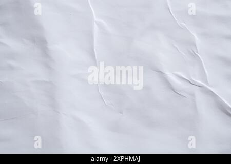 Blank white crumpled and creased paper poster texture background Stock Photo