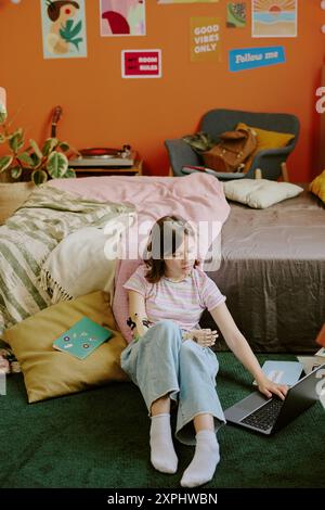 Teen Student Using Laptop At Home Stock Photo