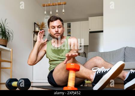 Caucasian man doing home workout,  ab exercise. Stock Photo