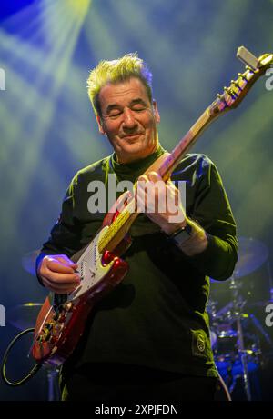 Eddie Lundon, guitarist and singer with the band China Crisis, performing on stage during a live concert in 2024 Stock Photo