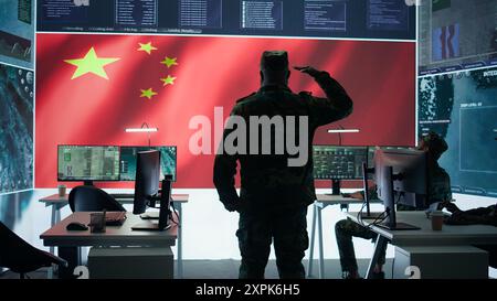 Army IT expert in control center collecting real time battlefield data, process satellite surveillance imagery for successful military defense mission. Using green screen isolated display. Camera A. Stock Photo