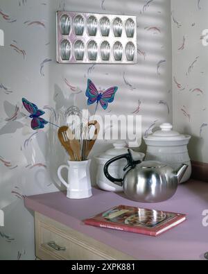 Kitchen with wallpaper, 50's, 60's, 70's, 80's, styled with food, antique accessories Stock Photo