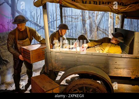 TRIANGLE, Virginia — The Field Ambulance in a Model T Truck Exhibit at the National Museum of the Marine Corps showcases a key component of the American Expeditionary Forces (A.E.F.) during World War I. This exhibit highlights the role of the Ford Model T, the first motorized vehicle to see extensive military use, with over 15,000 Model T Fords serving in the A.E.F. The displayed vehicle, similar to the 'Elizabeth Ford' used by the 6th Marines, features original markings and offers insight into its crucial role in transporting ammunition, supplies, and the wounded during battle. Stock Photo