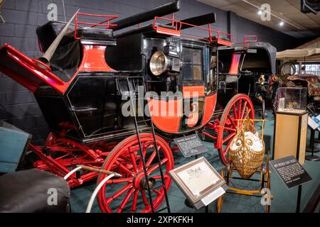 LURAY, Virginia, United States — An 1840-1850 Road Coach on display at the Car and Carriage Caravan Museum in Luray, Virginia. This vehicle, made by Holland & Holland in London, England, was the 'bus' of its period, capable of transporting 20 people and their luggage, and pulled by four horses. Stock Photo